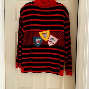 Red, Blk Striped & Plaid Shirt. Has 3 Switzerland Logos On Front.